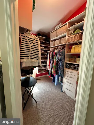 a bedroom with furniture and a ceiling fan