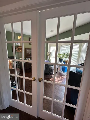a view of living room with furniture and large window
