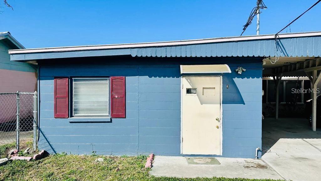 1310 North Combee Road, Unit 3 Lakeland, FL 33801 - Photo 1 of 1 a front view of a house with a garage