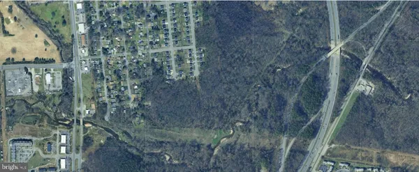 a aerial view of a house with a yard