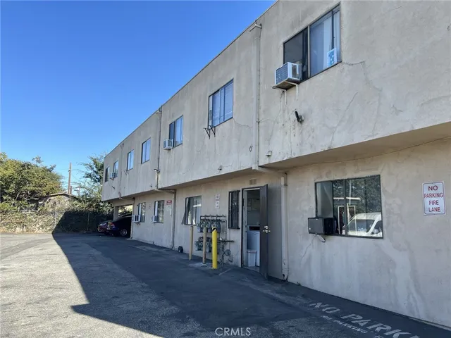 a view of swimming pool with a car parked