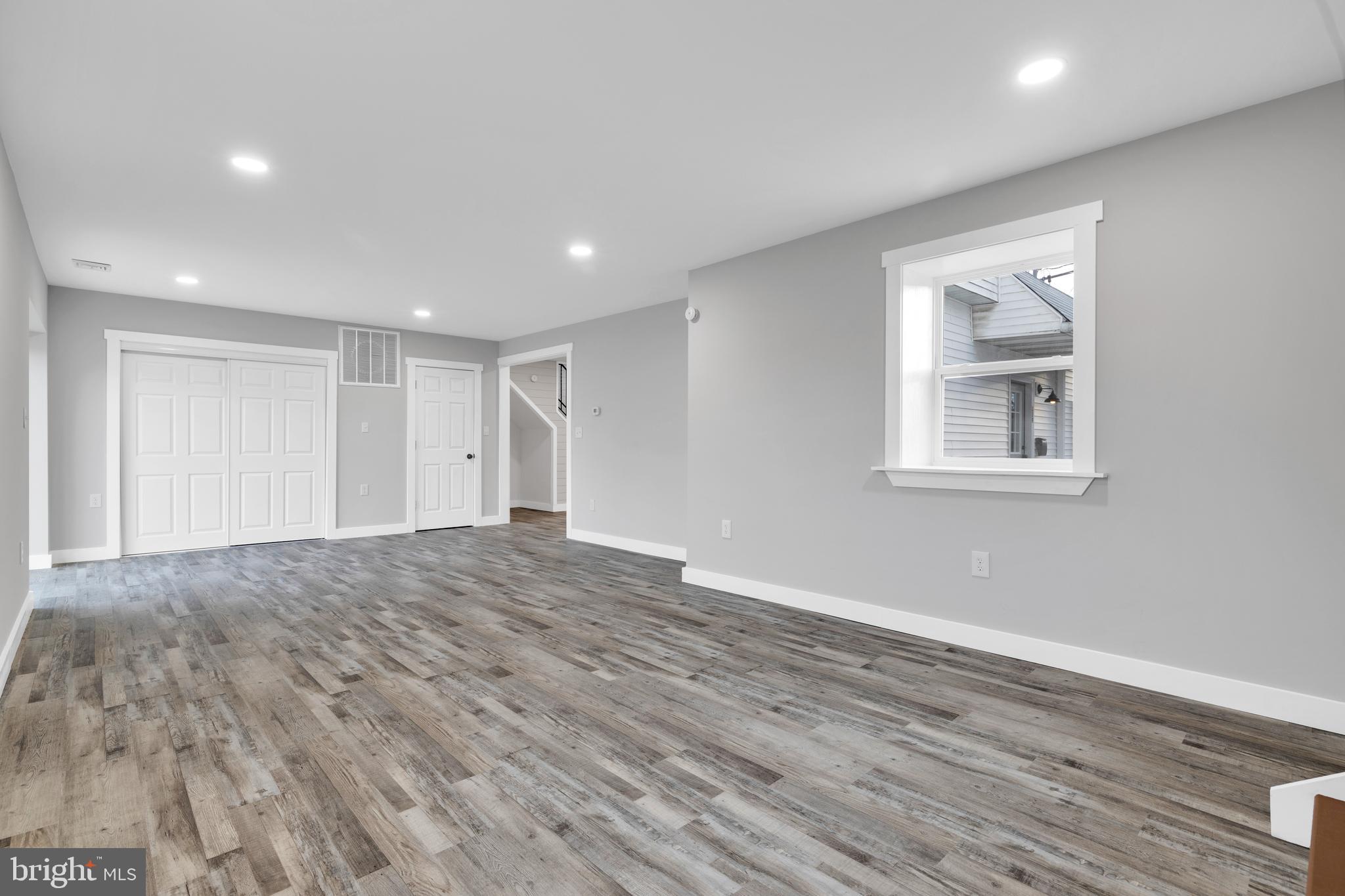 119 Heidelberg Avenue Reading, PA 19606 - Photo 13 of 36 a view of empty room with wooden floor and fan