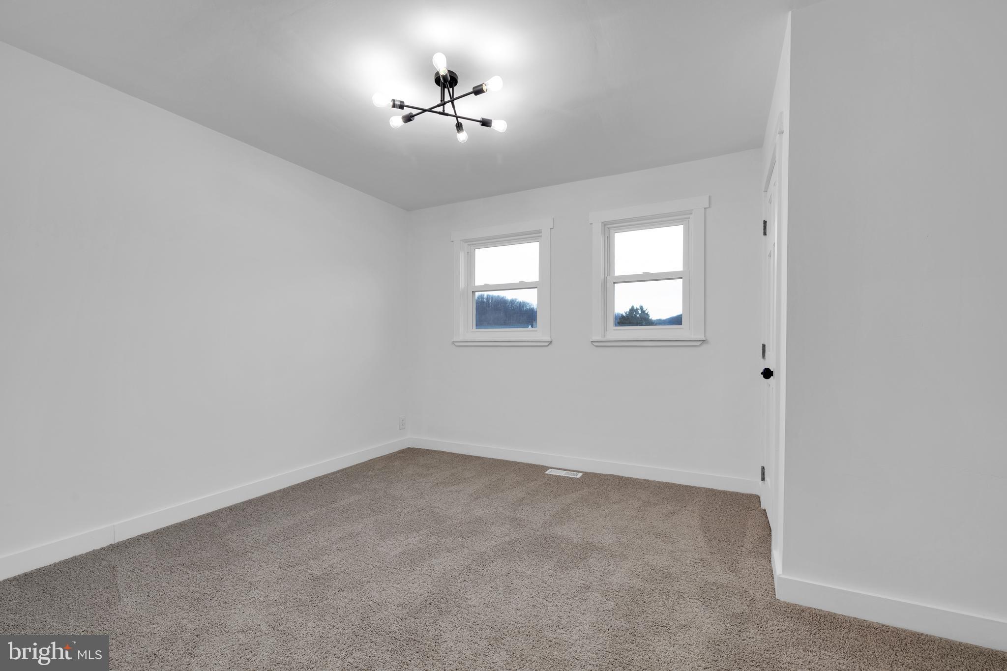 119 Heidelberg Avenue Reading, PA 19606 - Photo 24 of 38 wooden floor in an empty room with a window