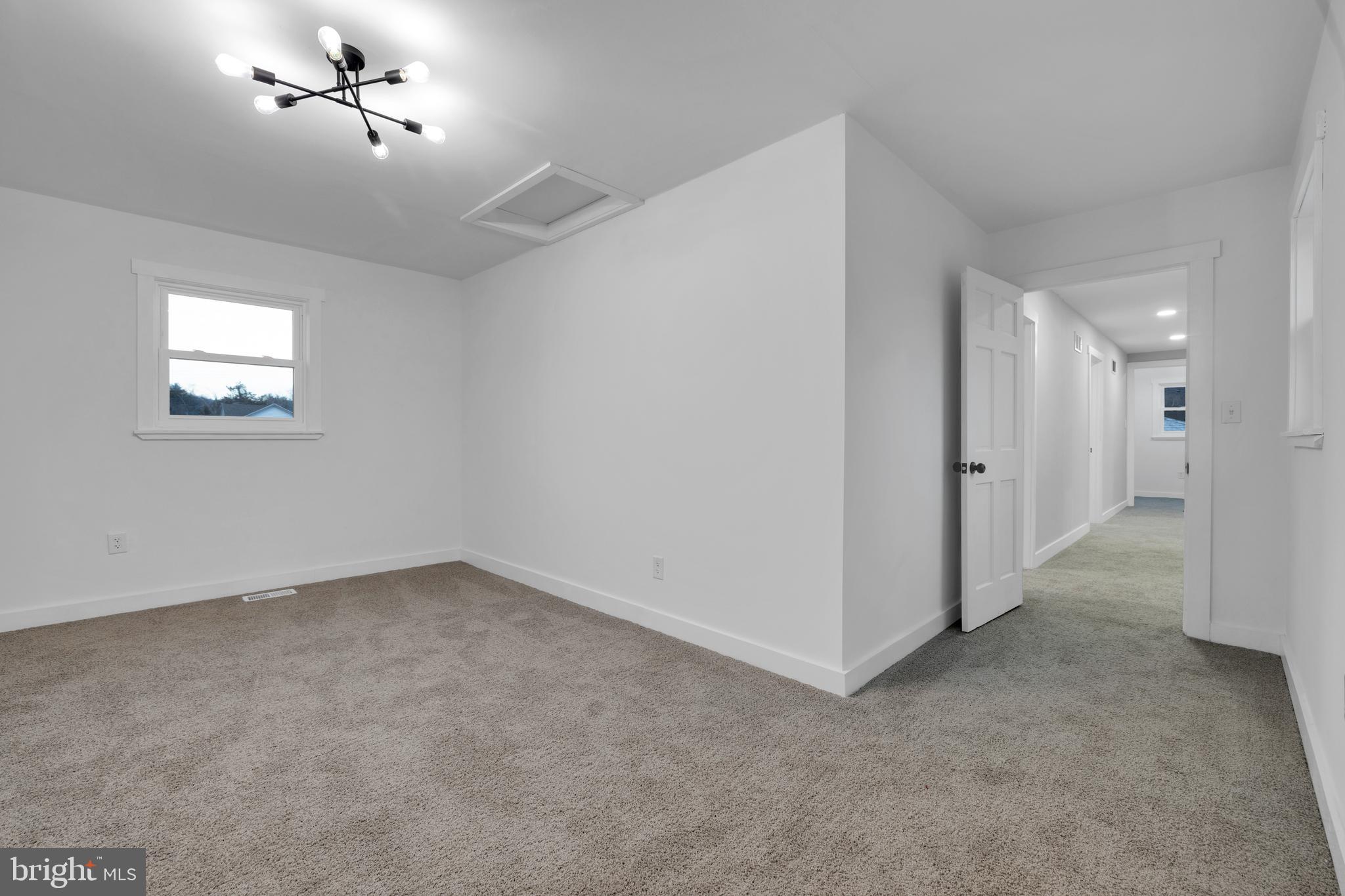 119 Heidelberg Avenue Reading, PA 19606 - Photo 31 of 38 an empty room with a ceiling fan and window