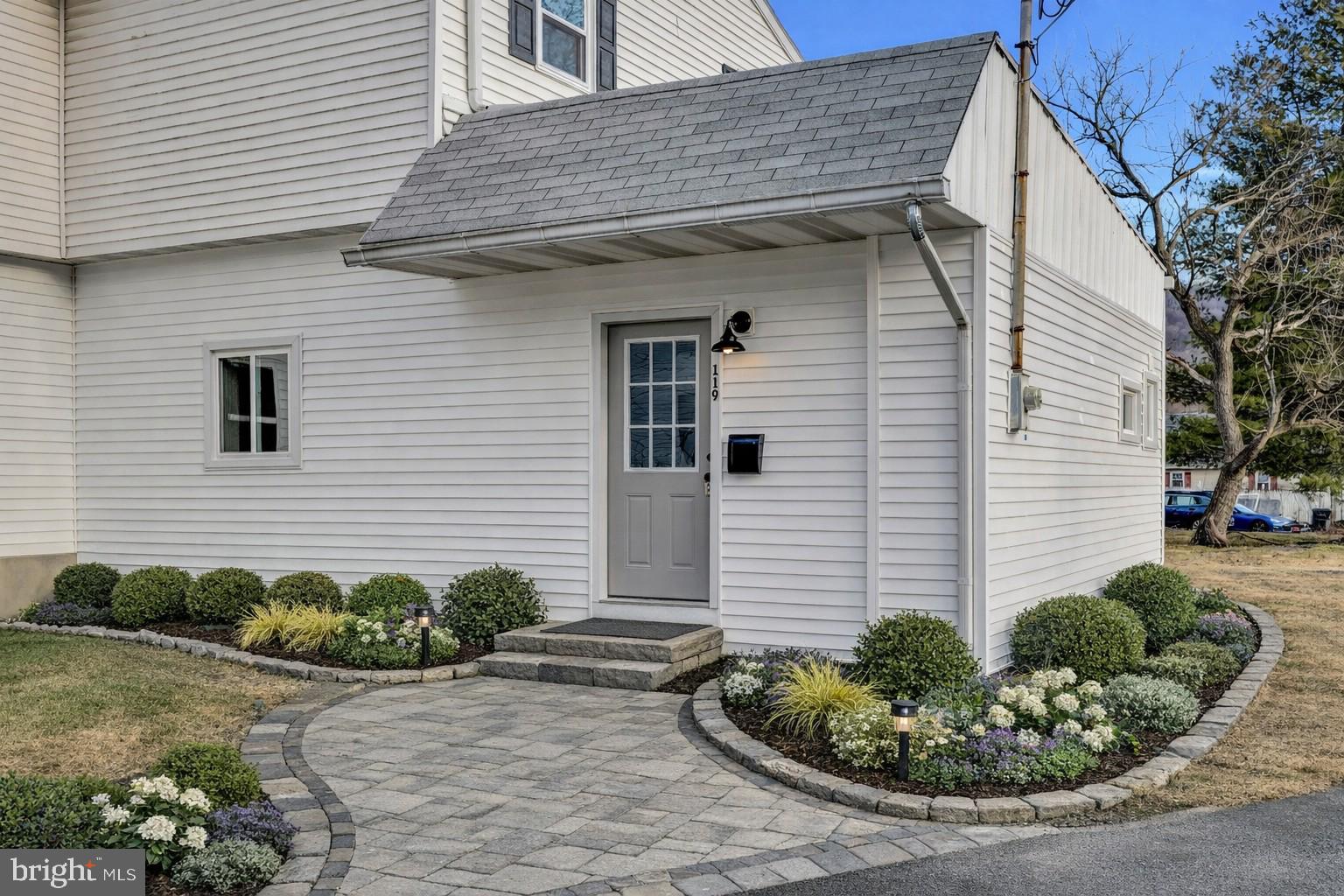 119 Heidelberg Avenue Reading, PA 19606 - Photo 4 of 38 a view of a house with a yard and potted plants