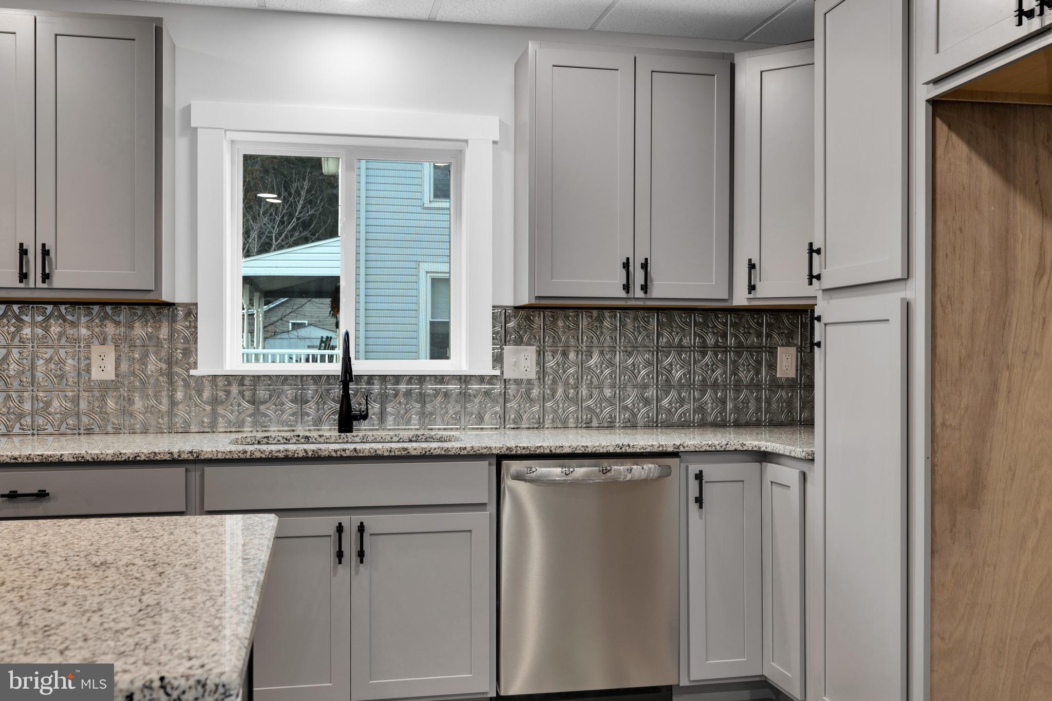 119 Heidelberg Avenue Reading, PA 19606 - Photo 9 of 38 a kitchen with granite countertop a sink and cabinets
