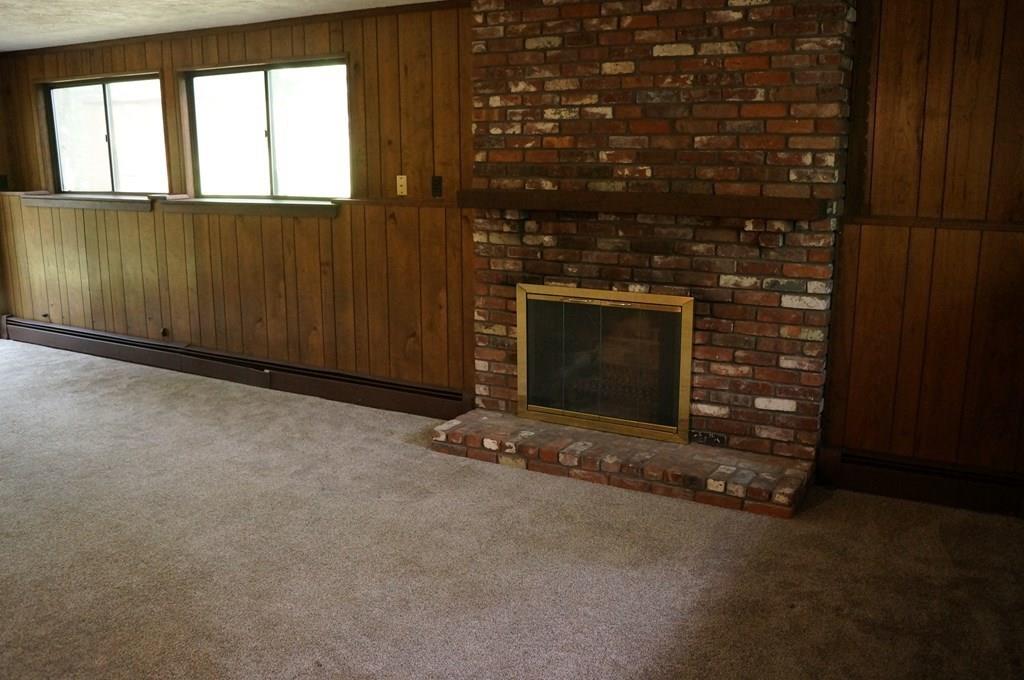 47 Ann Lees Road Harvard, MA 01451 - Photo 20 of 30 a view of an empty room with a fireplace