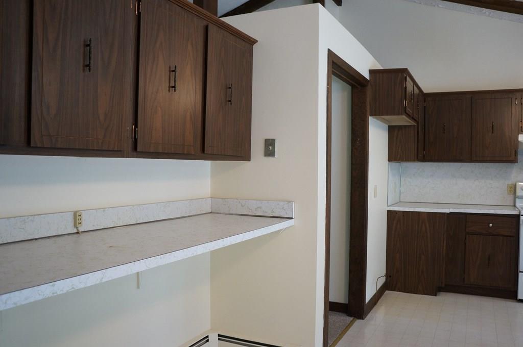 47 Ann Lees Road Harvard, MA 01451 - Photo 10 of 30 a kitchen with a refrigerator and cabinets