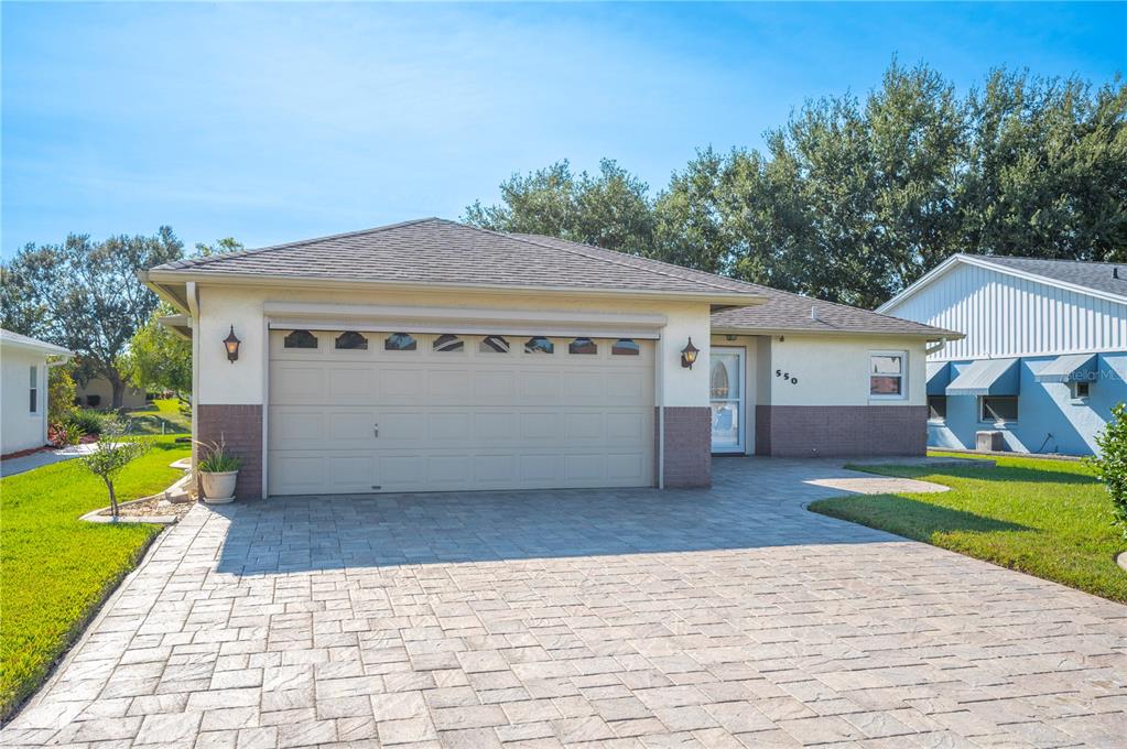 550 Eagle Run Lakeland, FL 33809 - Photo 1 of 1 a front view of house with yard and green space