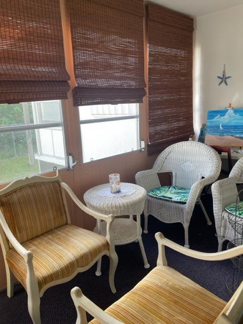 2960 Cynthia Lane, Unit 206 Lake Worth Beach, FL 33461 - Photo 23 of 38 a view of a dining room with furniture and window