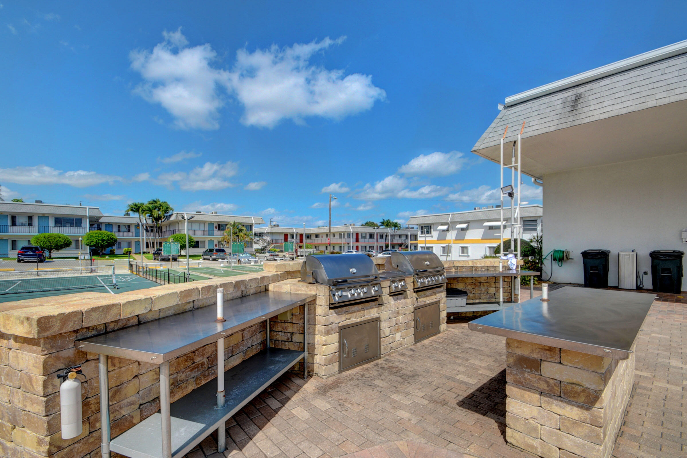 2960 Cynthia Lane, Unit 206 Lake Worth Beach, FL 33461 - Photo 29 of 38 a view of a kitchen with kitchen island and a stove