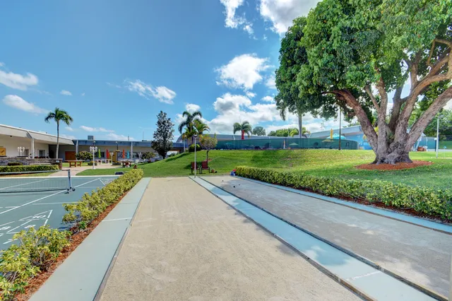 a view of a street with a houses on both side