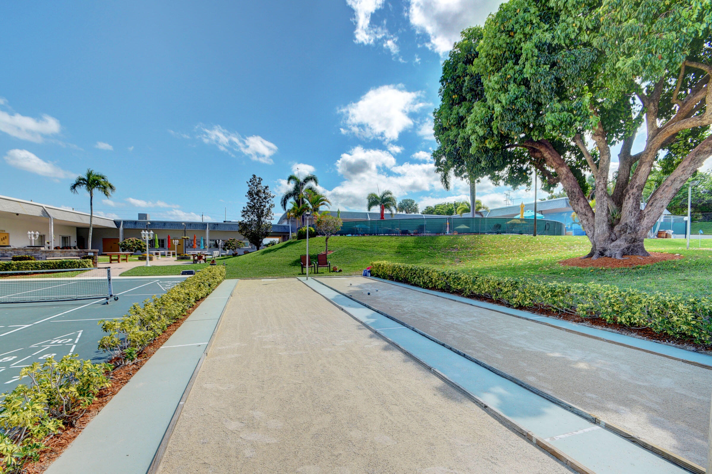 2960 Cynthia Lane, Unit 206 Lake Worth Beach, FL 33461 - Photo 30 of 38 a view of a street with a houses on both side