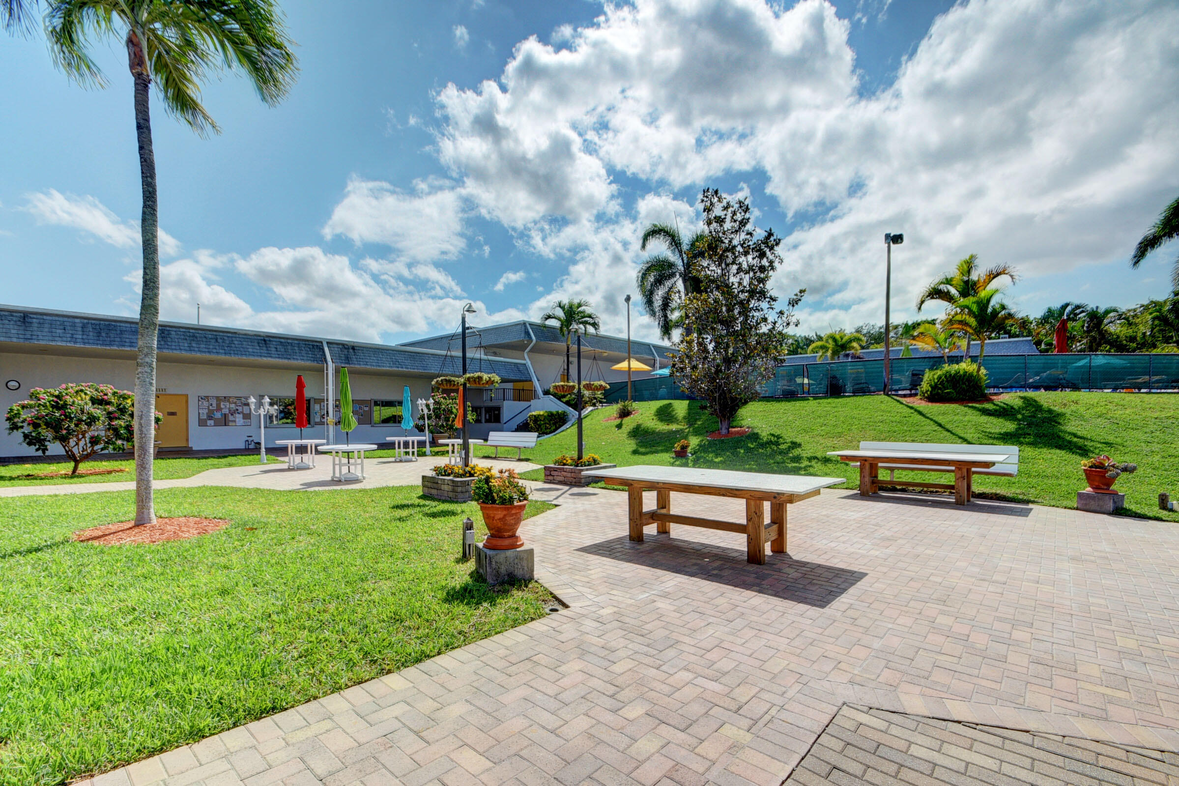 2960 Cynthia Lane, Unit 206 Lake Worth Beach, FL 33461 - Photo 33 of 38 a garden view with a sitting space