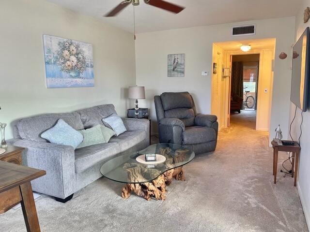 2960 Cynthia Lane, Unit 206 Lake Worth Beach, FL 33461 - Photo 7 of 38 a living room with furniture and a area