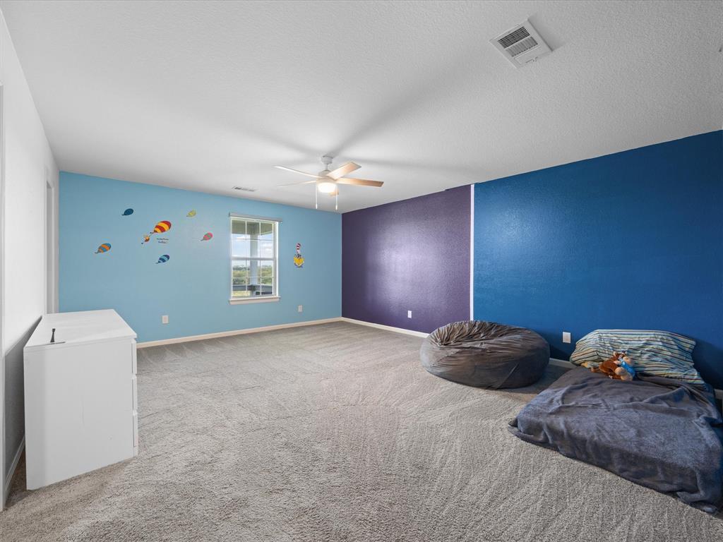 781 Alsdorf Road Ennis, TX 75119 - Photo 34 of 39 a workspace with a bed and a window