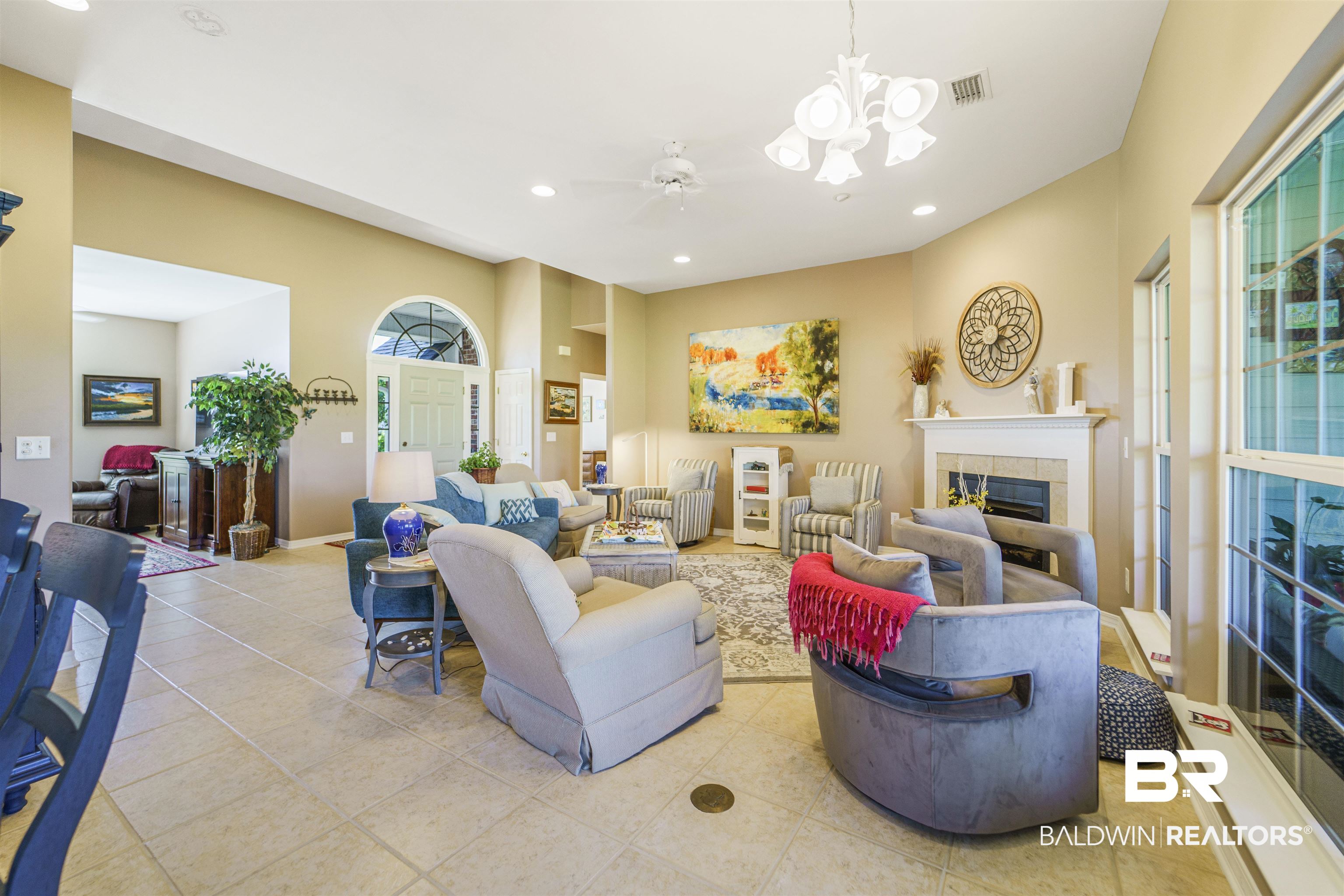9505 Lakeview Drive Foley, AL 36535 - Photo 10 of 38 Living area with ceiling fan, recessed lighting, a tiled fireplace, a chandelier, and light tile patterned floors