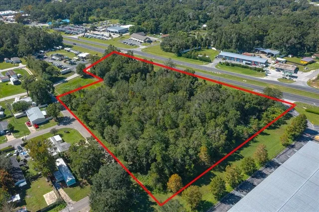 a view of a swimming pool and a yard