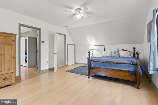 a bedroom with bed and window