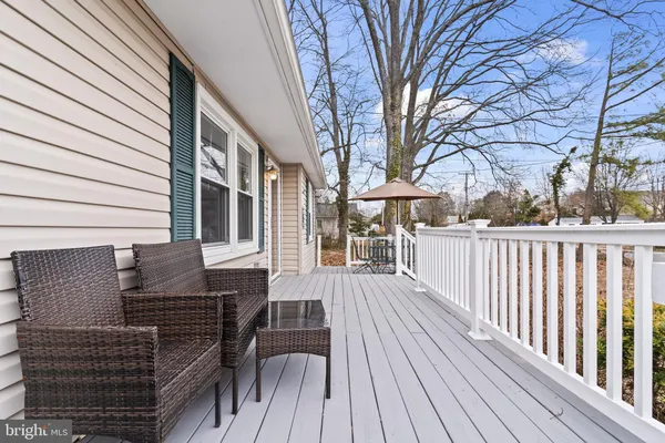 a view of a house with wooden deck