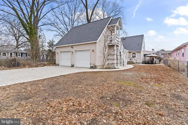 a view of a house with a yard covered in snow