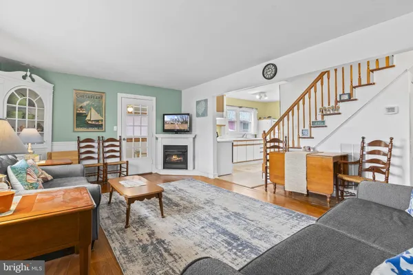 a living room with furniture and a rug