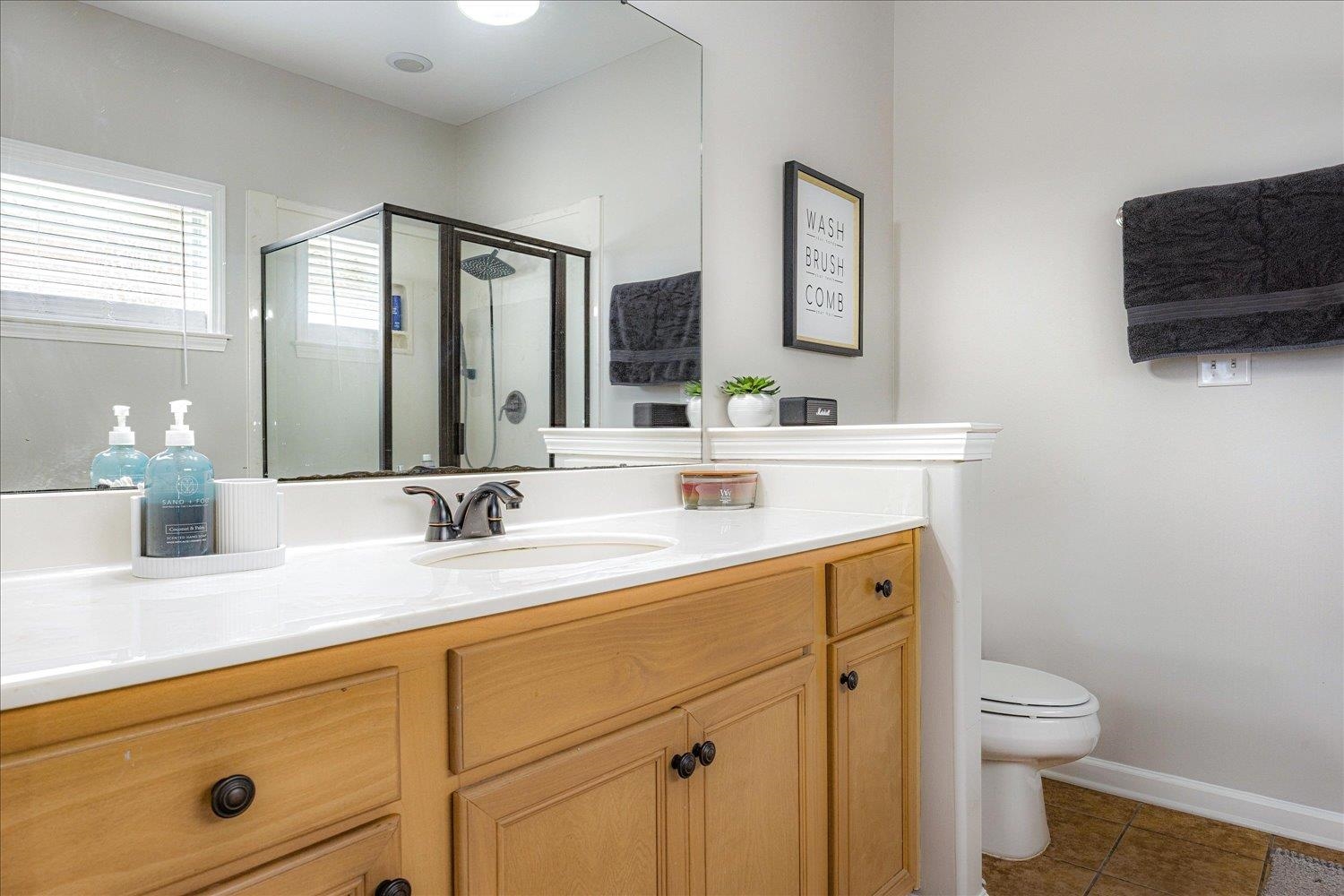 1568 Wynne Road Cordova, TN 38016 - Photo 8 of 30 Full bathroom with vanity, a stall shower, and tile patterned floors