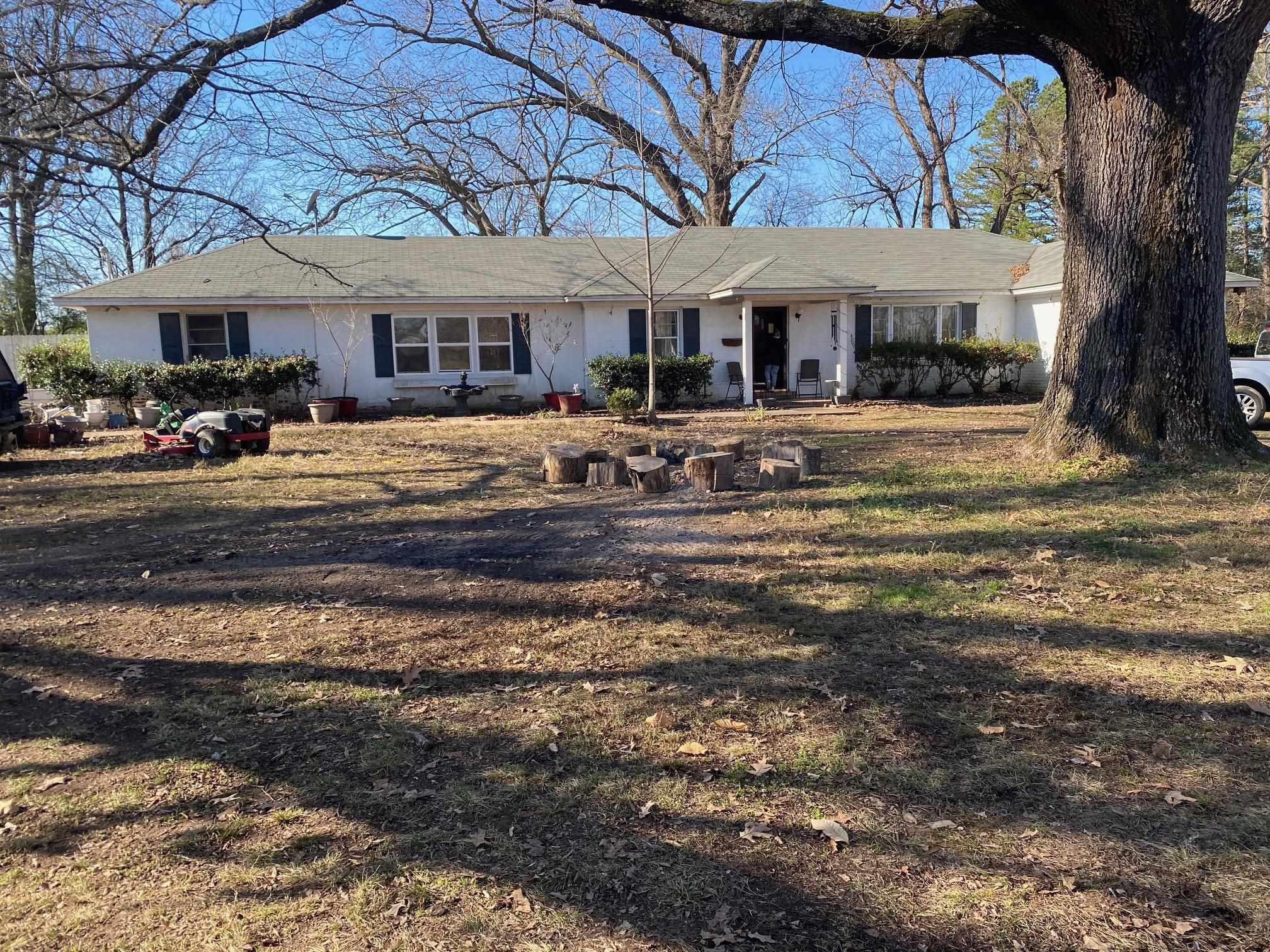 a front view of a building with a garden