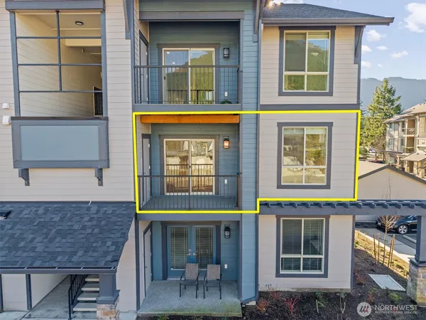 a view of a brick building with large windows