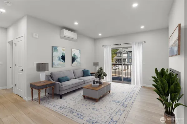 a living room with furniture and a potted plant