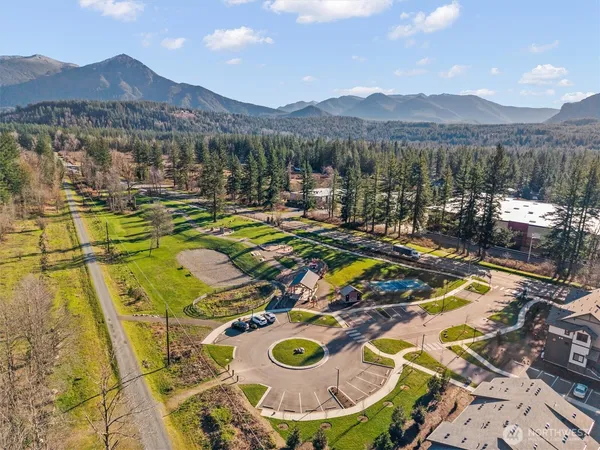 a view of a big yard of a building and mountain view