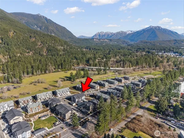a view of swimming pool with a yard and mountain view