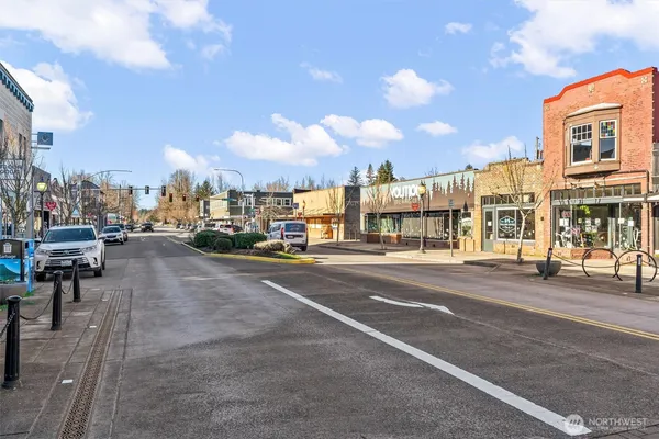 a view of multiple houses with a street