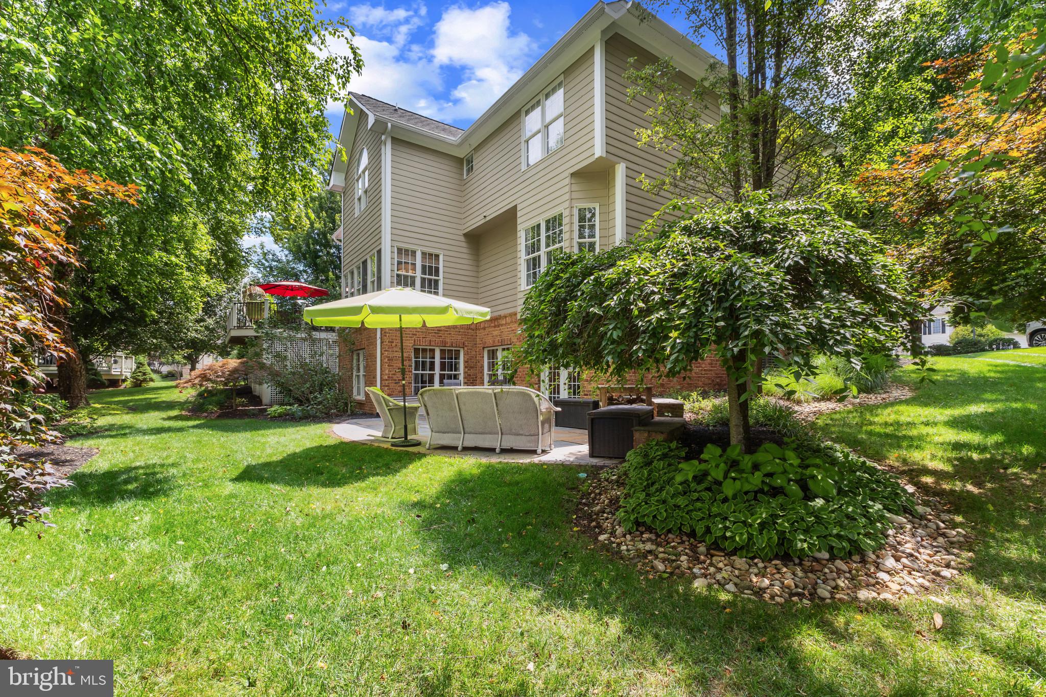 15006 Ransom Oaks Court Gainesville, VA 20155 - Photo 39 of 57 Serene backyard oasis with lush greenery.