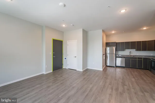 a view of kitchen with wooden floor