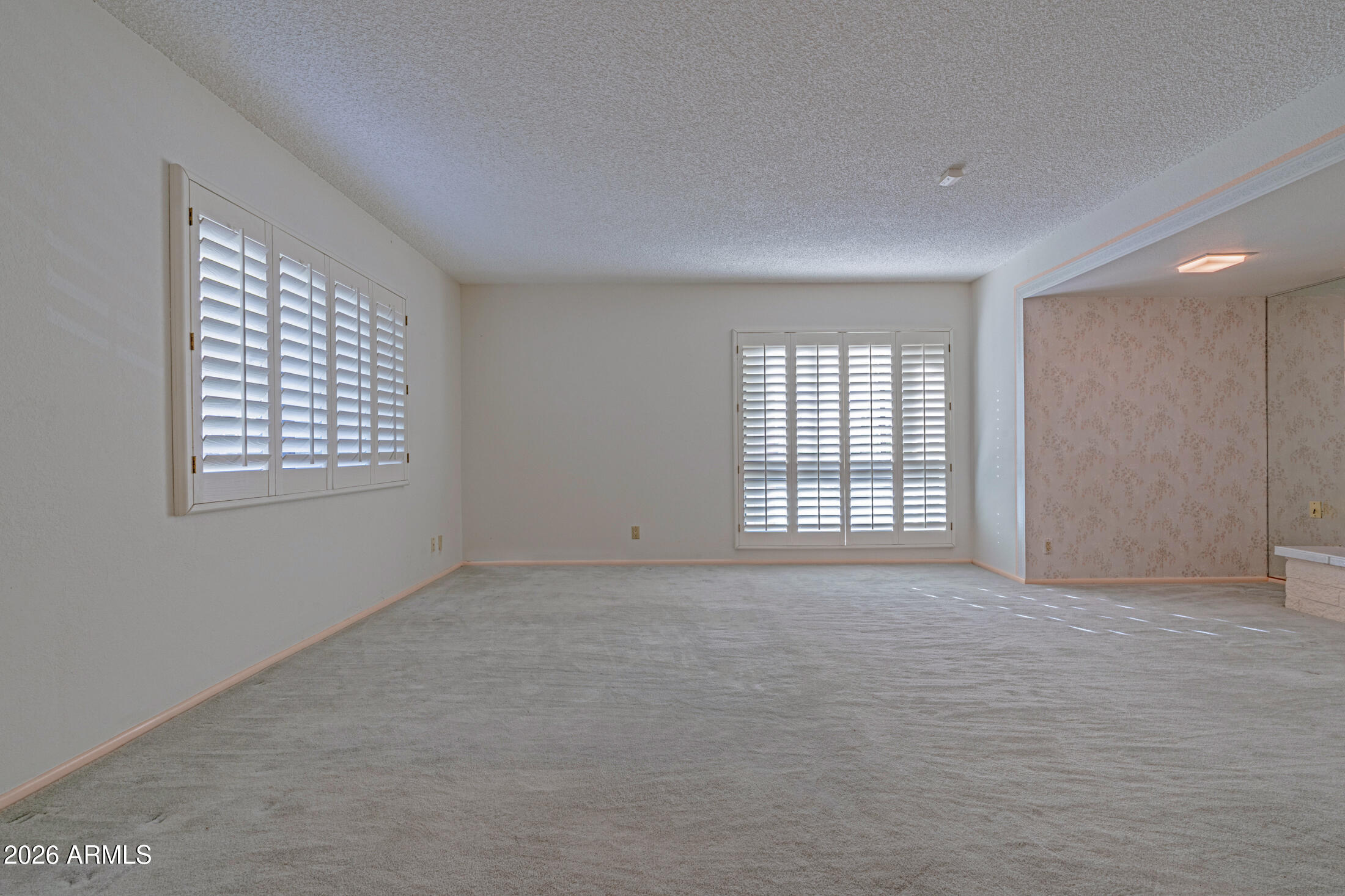 1052 West Estate Drive Miami, AZ 85539 - Photo 11 of 13 a view of an empty room with a window