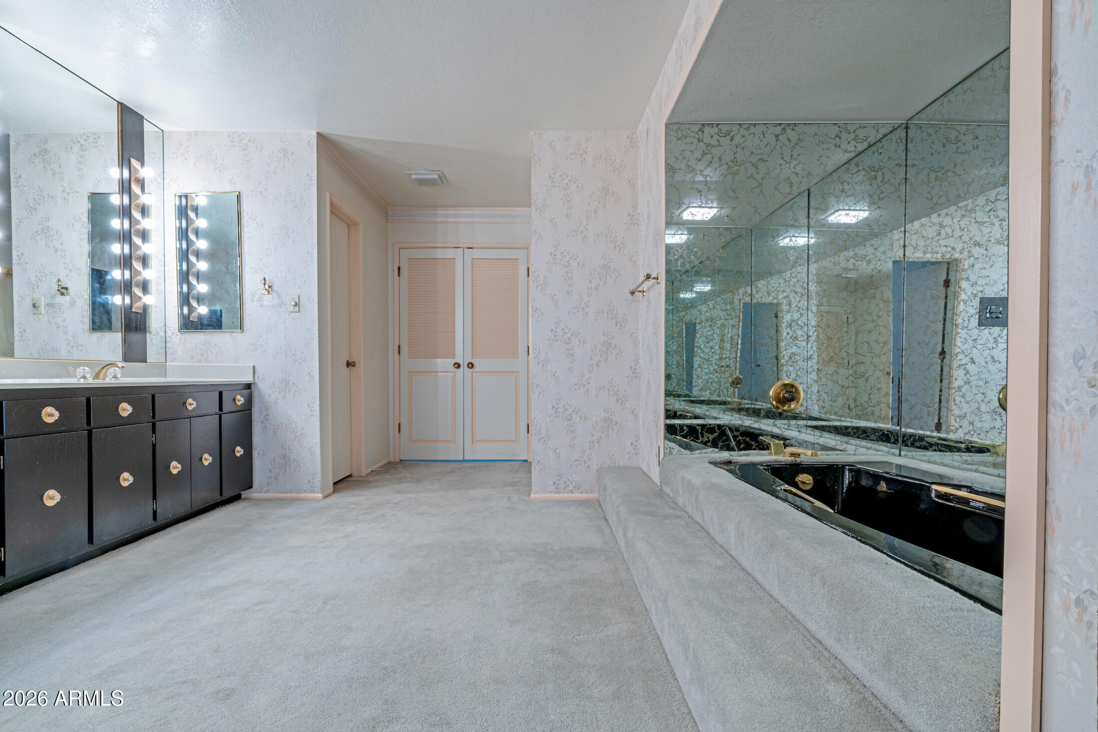 1052 West Estate Drive Miami, AZ 85539 - Photo 12 of 13 a spacious bathroom with a mirror a double vanity and a shower