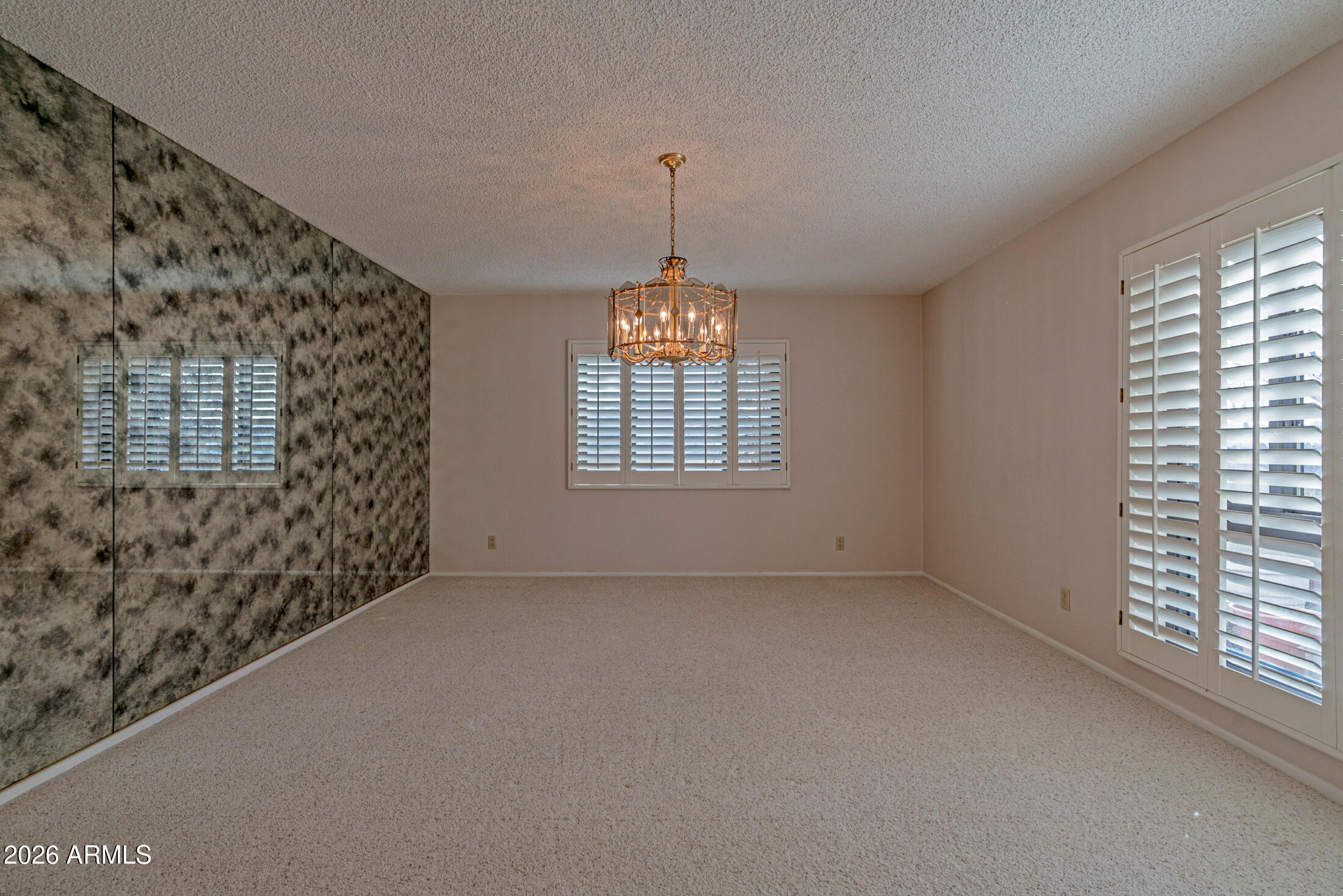 1052 West Estate Drive Miami, AZ 85539 - Photo 6 of 13 a view of an empty room with a window