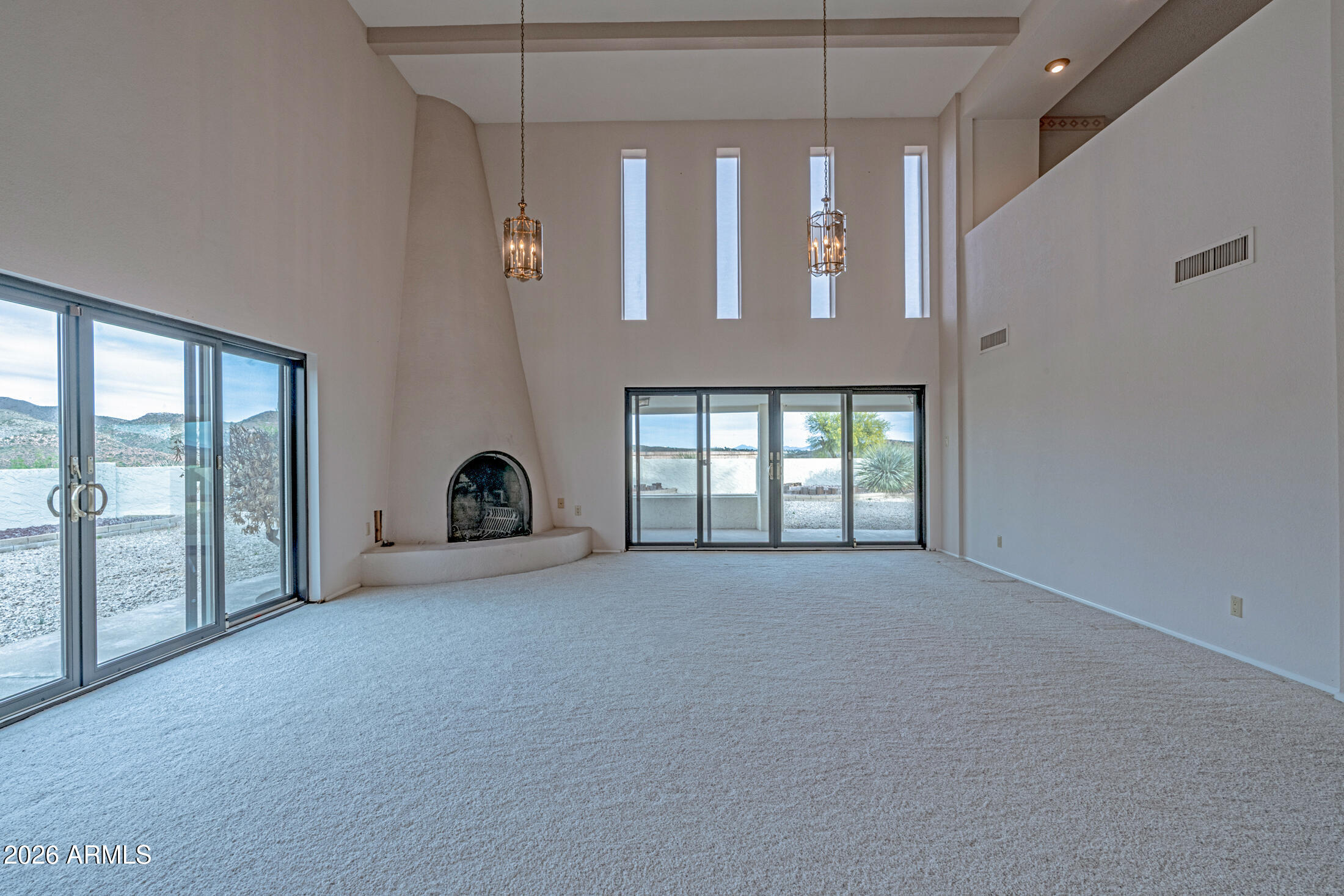 1052 West Estate Drive Miami, AZ 85539 - Photo 9 of 13 an empty room with windows
