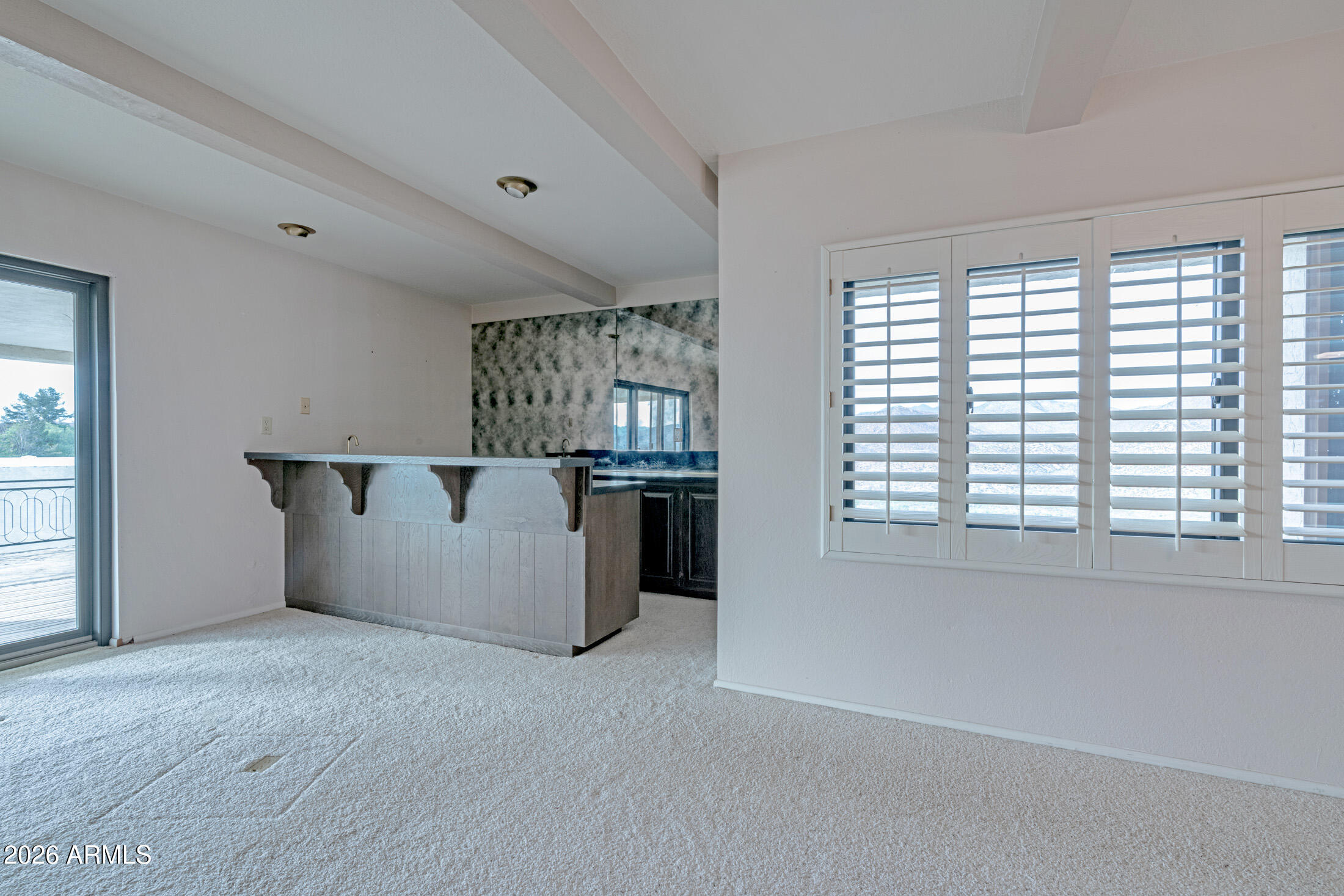 1052 West Estate Drive Miami, AZ 85539 - Photo 10 of 13 a view of an empty room with a window