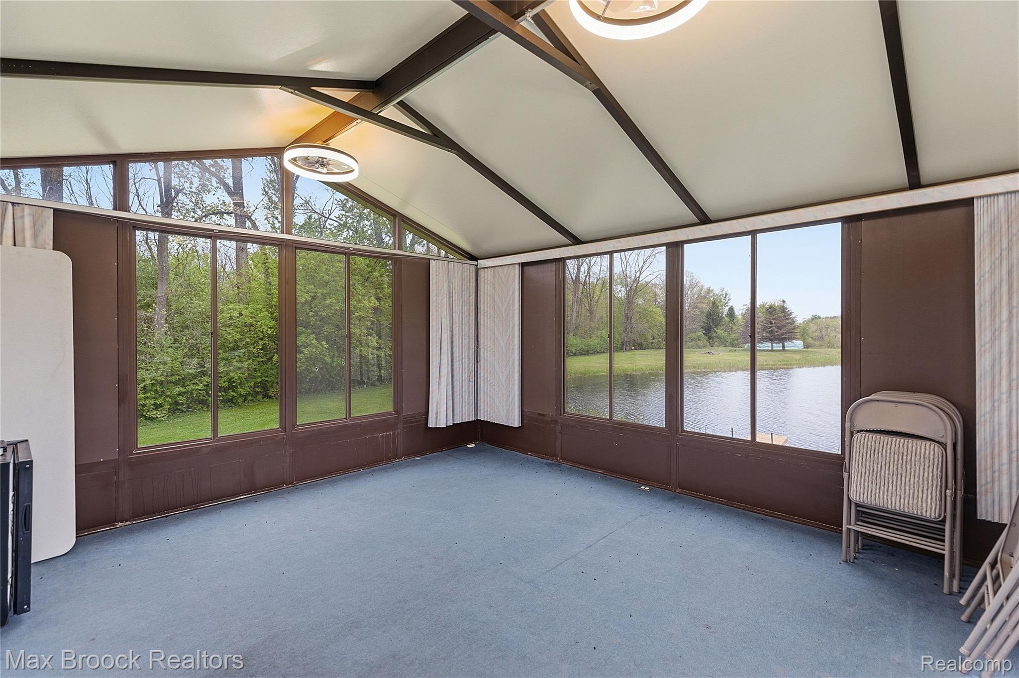 1392 Maple Grove Road Lapeer, MI 48446 - Photo 30 of 70 Unfurnished sunroom with a water view and beam ceiling