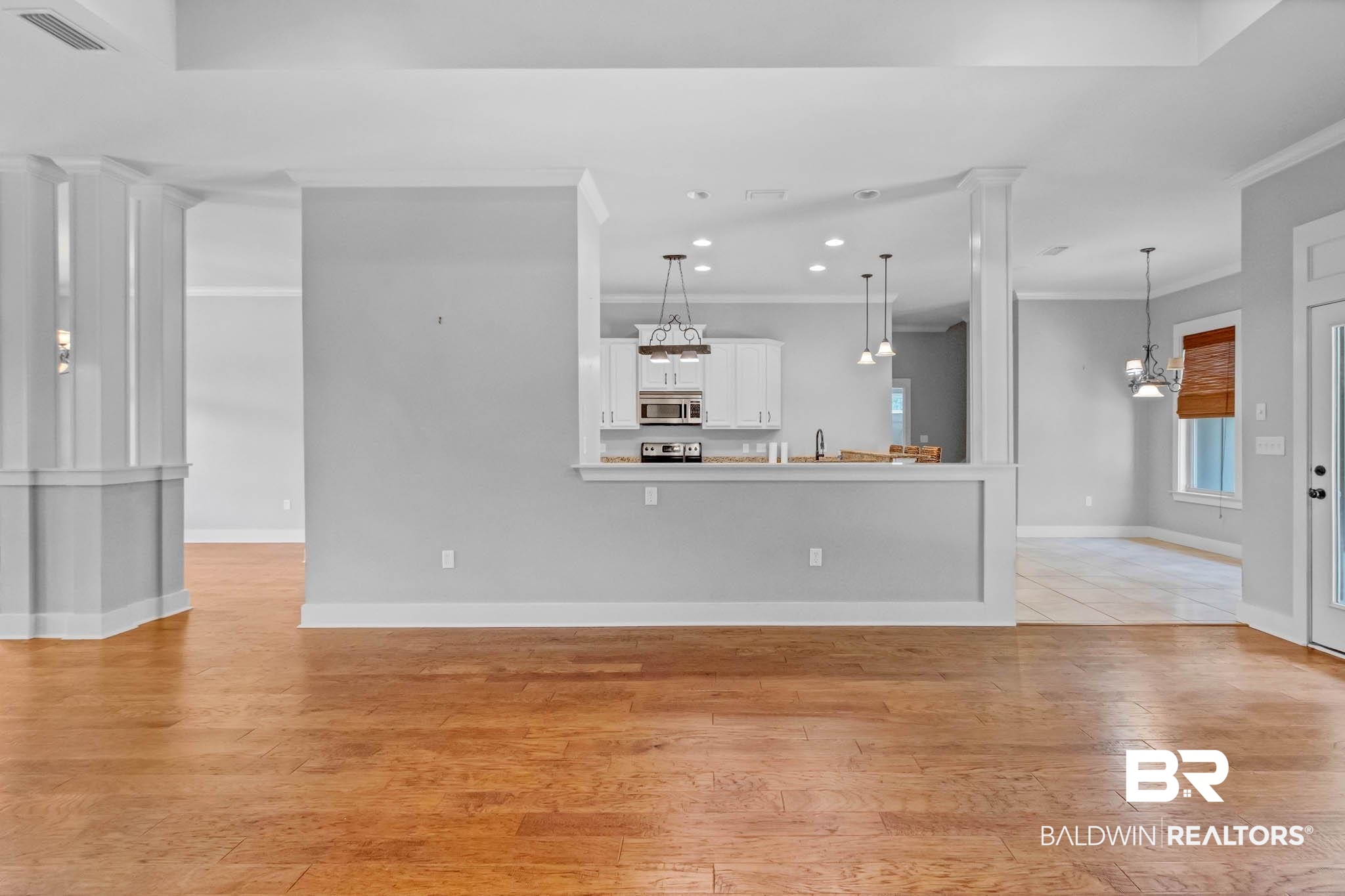 7854 Raegan Lane Daphne, AL 36527 - Photo 15 of 70 Living room with light wood-type flooring, crown molding, recessed lighting, and baseboards