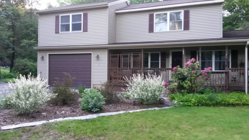 145 Anthony Road Tolland, CT 06084 - Photo 1 of 1 a front view of a house with garden