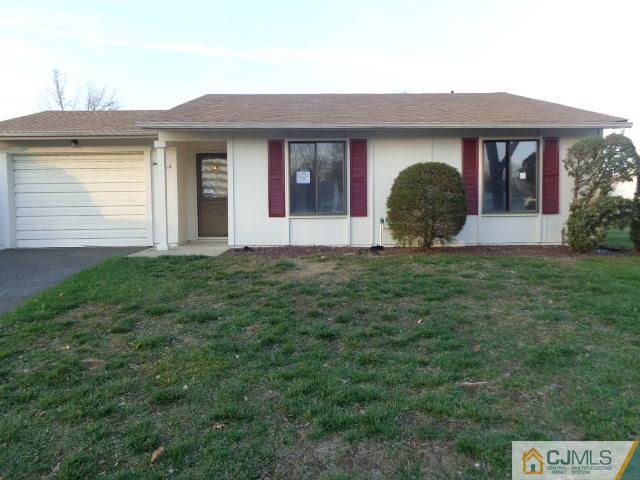 31 A Haddon Road Monroe Township, NJ 08831 - Photo 1 of 13 a front view of a house with garden