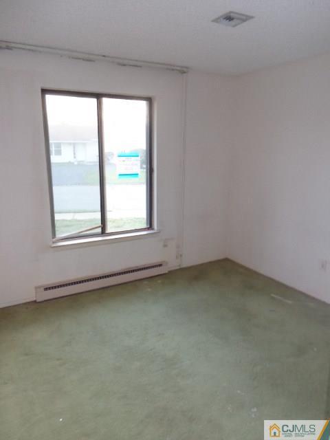 31 A Haddon Road Monroe Township, NJ 08831 - Photo 12 of 13 an empty room with a window