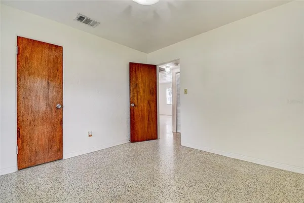 a view of an entryway with wooden floor