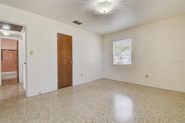a kitchen with stainless steel appliances granite countertop a refrigerator a sink dishwasher a stove with wooden cabinets