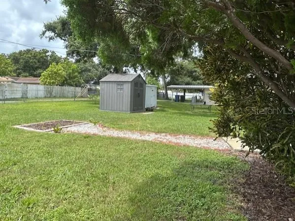 a view of backyard with green space