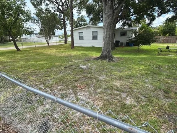 a view of a garden with a city