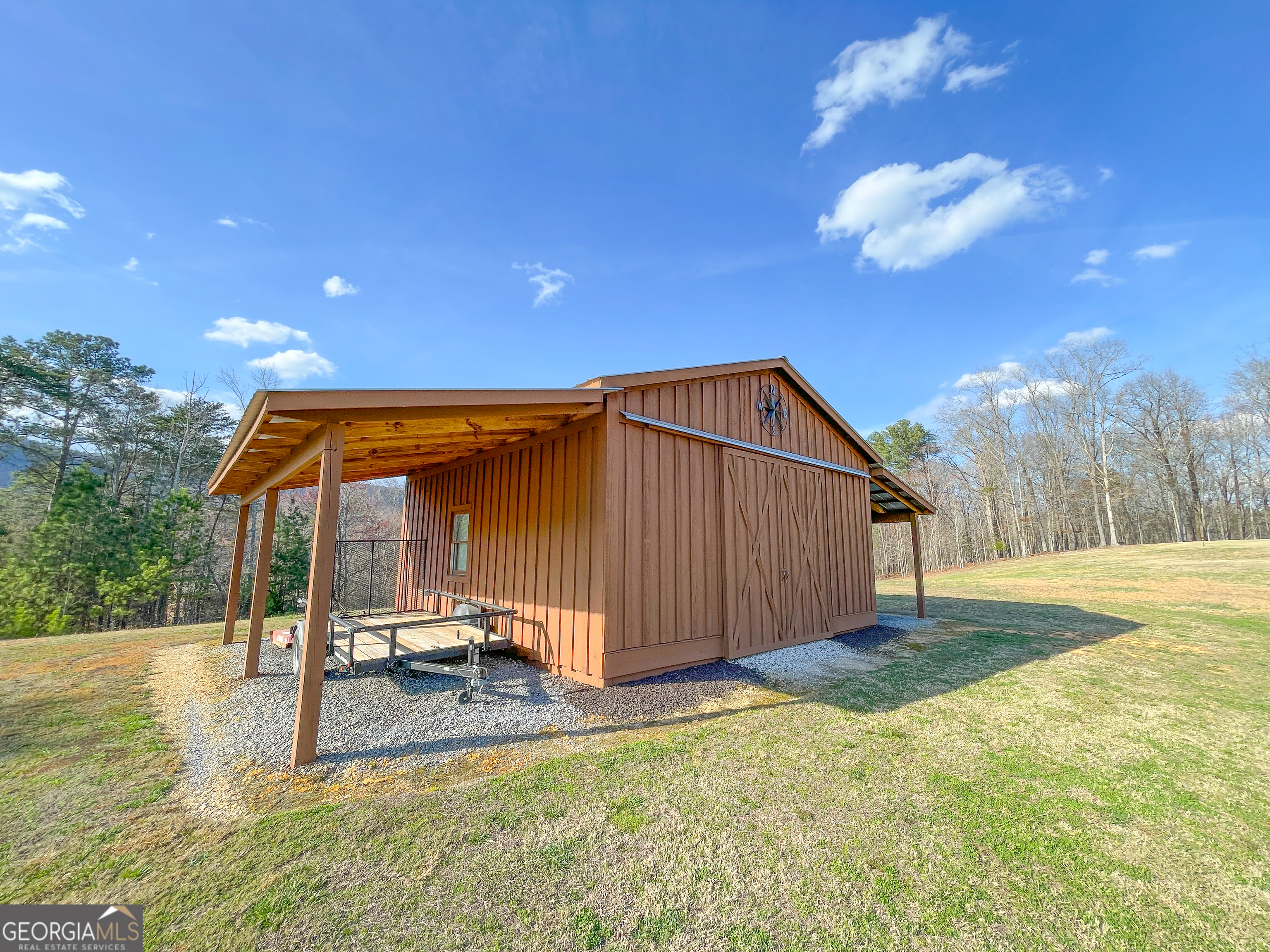 39 Acres On E Teloga Road Summerville, GA 30747 - Photo 5 of 50 a backyard of a house with table and chairs